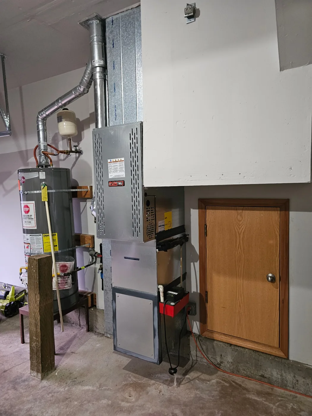 Completed furnace installation beside attic access in a Vancouver, WA garage